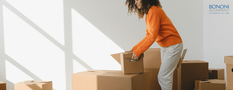 Woman packing and moving boxes